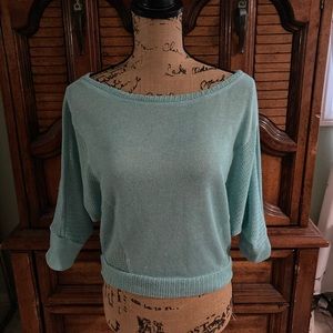 Woman’s teal top, size medium.